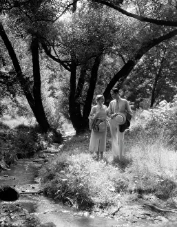 Hikes: 1930s Man & Woman Walking Along