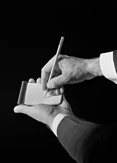 Man S: 1930s MAN'S HANDS WRITING ON NOTE PAD WITH PENCIL