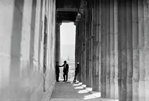 Hephaestus: 1930s - Three Men Standing in Column Lined Passageway Temp