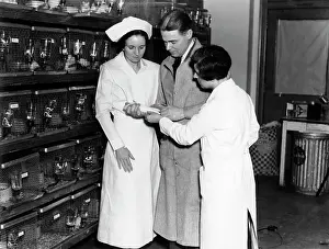 Progressing: 1930s two nurses and lab technician man women