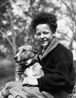 Mutt: 1930s - Smiling Boy Looking at Camera Holding Dog