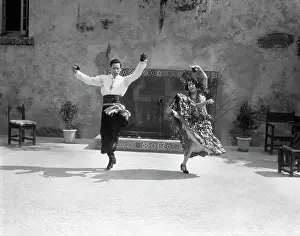 Castanets: 1930s Smiling Couple Dressed In