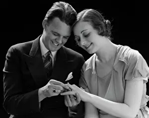 Romantics: 1930s Smiling Couple Sitting