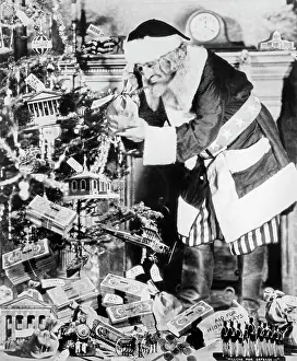 Sufferer: 1930s uncle sam dressed as santa claus decorating
