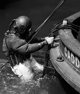 Umbilical: 1930s Side View Of Diver In Pressure