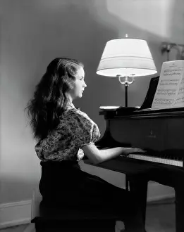 Keyboards: 1930s Side View Of Girl Playing