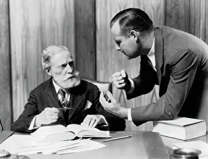 Disagree: 193Os Two Men In Office At Desk