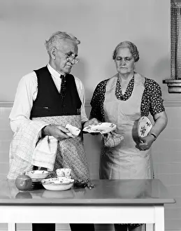 Dishwashing: 1940s 1950s Elderly Couple Man