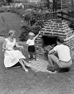 Cookout: 1940s 1950s Family In Backyard