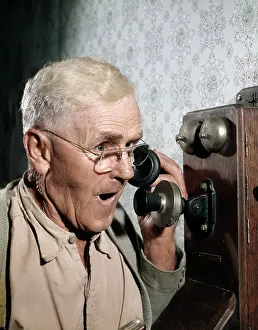 Mouthpiece: 1940s 1950s MAN USING OLD-FASHIONED WALL MOUNTED