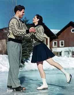 Cam001: 1940s 1950s Smiling Couple Ice