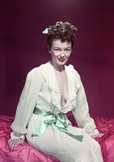 Coquette: 1940s 1950s Smiling Woman Wearing White Negligee Slip Robe P