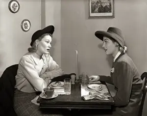 Lunching: 1940s 2 WOMEN DINING TALKING RESTAURANT TABLE