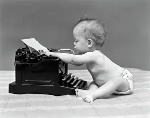 Diapers: 1940s BABY IN DIAPER TYPING ON TYPEWRITER