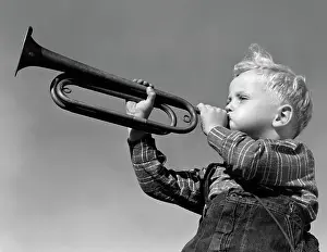 Buglers: 1940s BOY BLOWING BUGLE OUTDOOR