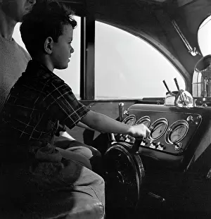 Egx001: 1940s Boy Sitting At Controls