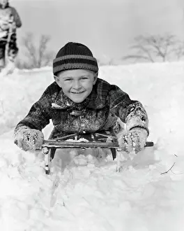 1940s Boy On Sled In Snow Facing