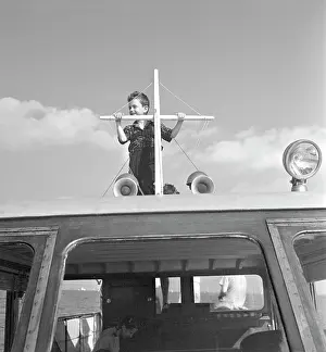 Egx001: 1940s Boy Standing On Top Of Motor