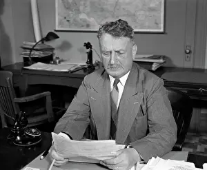 Businesspeople: 1940s Businessman At Desk Reading