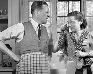 Wipe: 1940s Couple In Kitchen Wearing