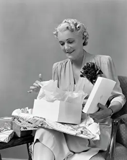 Unwrapping: 1940s Elder Woman Opening Gift