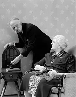 Retiree: 1940s Elderly Couple Listening