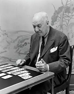 Solitaire: 1940s Elderly Man Playing Solitaire