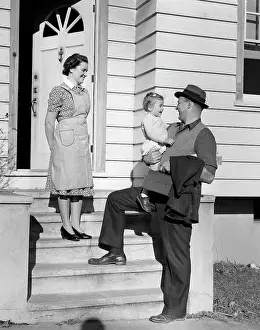 Breadwinner: 1940s Father On Steps Holding
