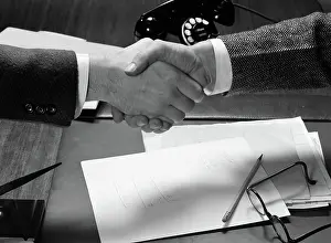 Desktop: 1940s HANDS CLOSE-UP TWO BUSINESSMEN SHAKING