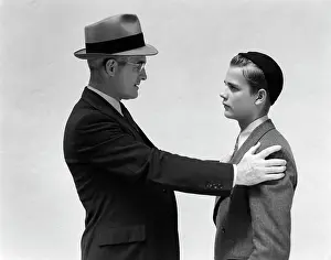 Mentoring: 1940s Man And Boy Father Son Facing