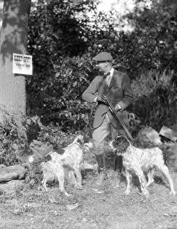 Gunning: 1940s Man With Two Dogs Holding
