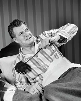 Perturbed: 1940s Man Sitting In Bed With