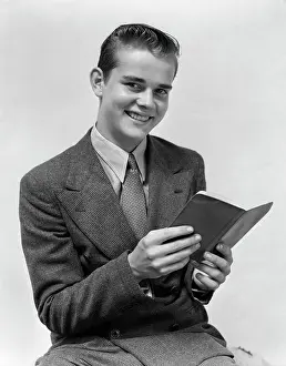 1940s Man In Suit Smiling Holding