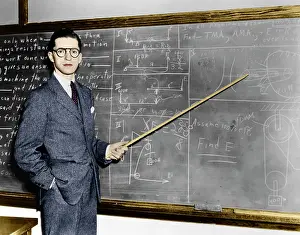 Eraser: 1940s - Man Teacher Professor Pointing Pointer at Blackboa
