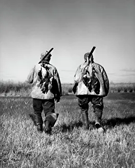 Gunning: 1940s Two Men Back View Walking