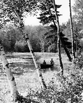 Canoeing: 1940s Pair Of Men Canoeing In