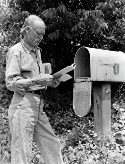 Usps: 1940s Senior Farmer Reading Mail