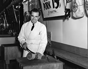 Slicing: 1940s Smiling Man Butcher Slicing