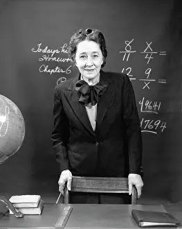 Fractions: 1940s Smiling School Teacher Standing