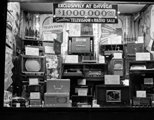 Merchandising: 1940s WINDOW OF STORE SELLING RADIOS AND TELEVISIONS