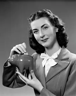 Prudent: 1940s Woman Putting Change Into