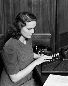 Bookkeeper: 1940s Woman Typing Typewriter