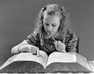 Definition: 1940s Young Girl Looking In Dictionary