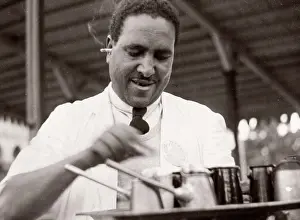 Oficcer: 1943 Egypt waiter serving coffee with cigarette in ear
