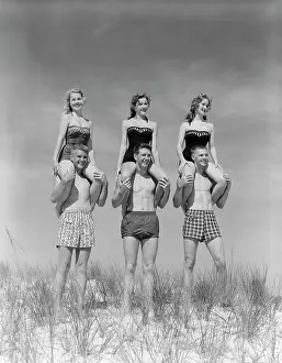 Piggyback: 1950s 1960s THREE COUPLES AT BEACH ON DUNES WITH