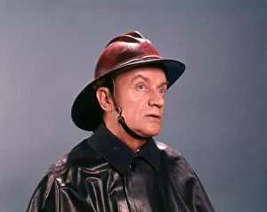Slicker: 1950s 1960s Serious Man Fireman Firefighter Portrait