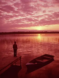 Lef001: 1950s 1960s Older Boy Standing on End of Dock looking int