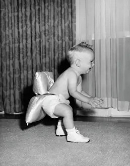 Booties: 1950s Baby Learning To Walk Wearing