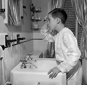 Hbb001: 1950s Boy Combing Hair Looking