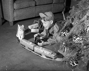 Evergreens: 1950s Boy In Engineer Outfit Playing